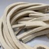 British Felt Off-white Felt Bearing Strips are loosely coiled on a light grey surface.