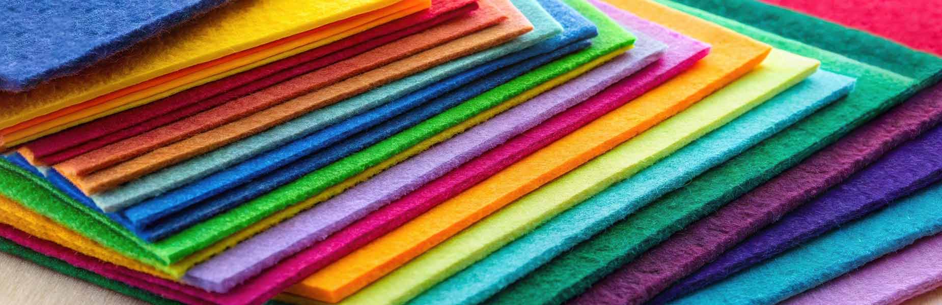 British Felt Stacks of British felt sheets in bright colours, perfect for adding charm to any home craft project.